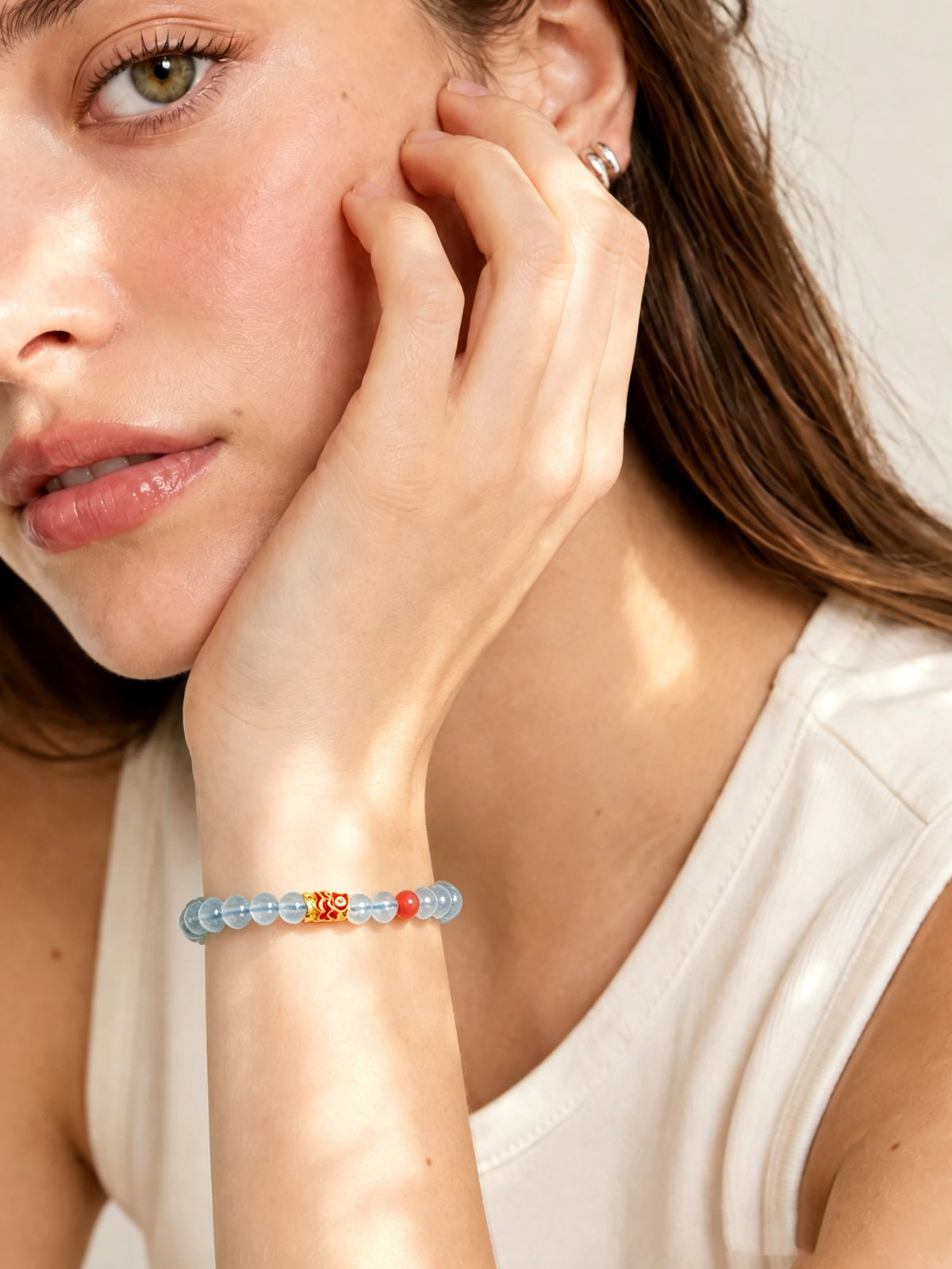 Aquamarine Koi Charm Bracelet worn on the wrist